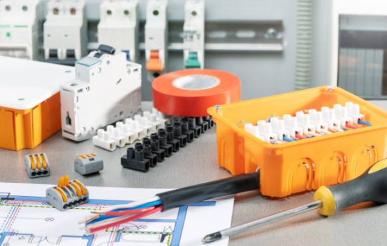 Set of electrician tools and equipments on desk with scheme, flat lay. repair, check electrical system concept.